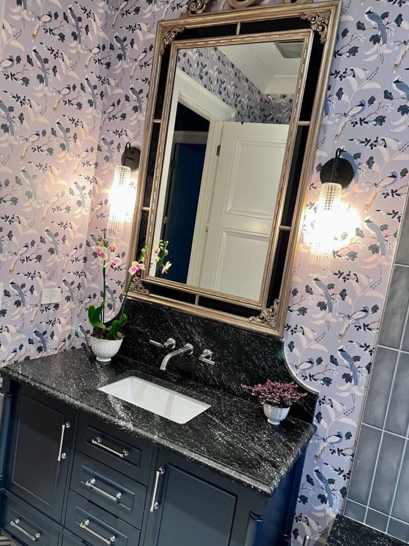 A bathroom with a sink and mirror in it