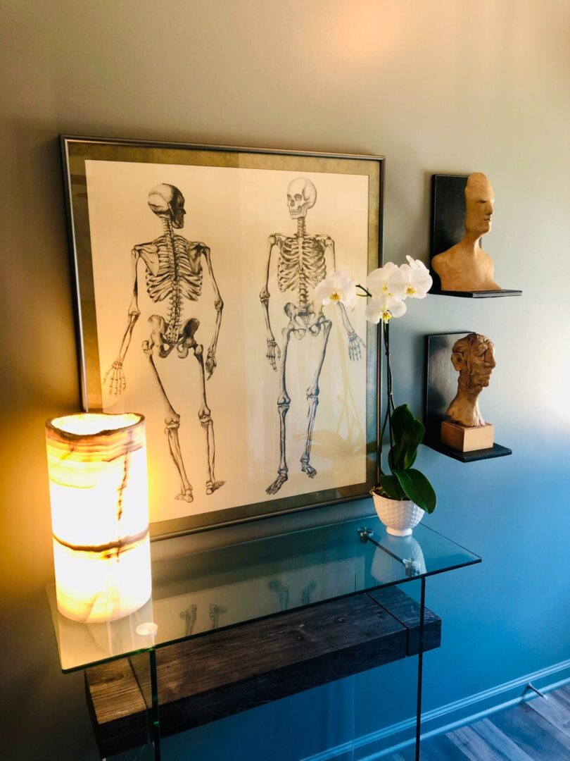 A picture of two skeletons on the wall