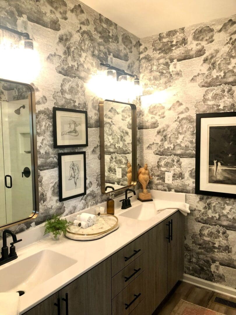 A bathroom with two sinks and a mirror.