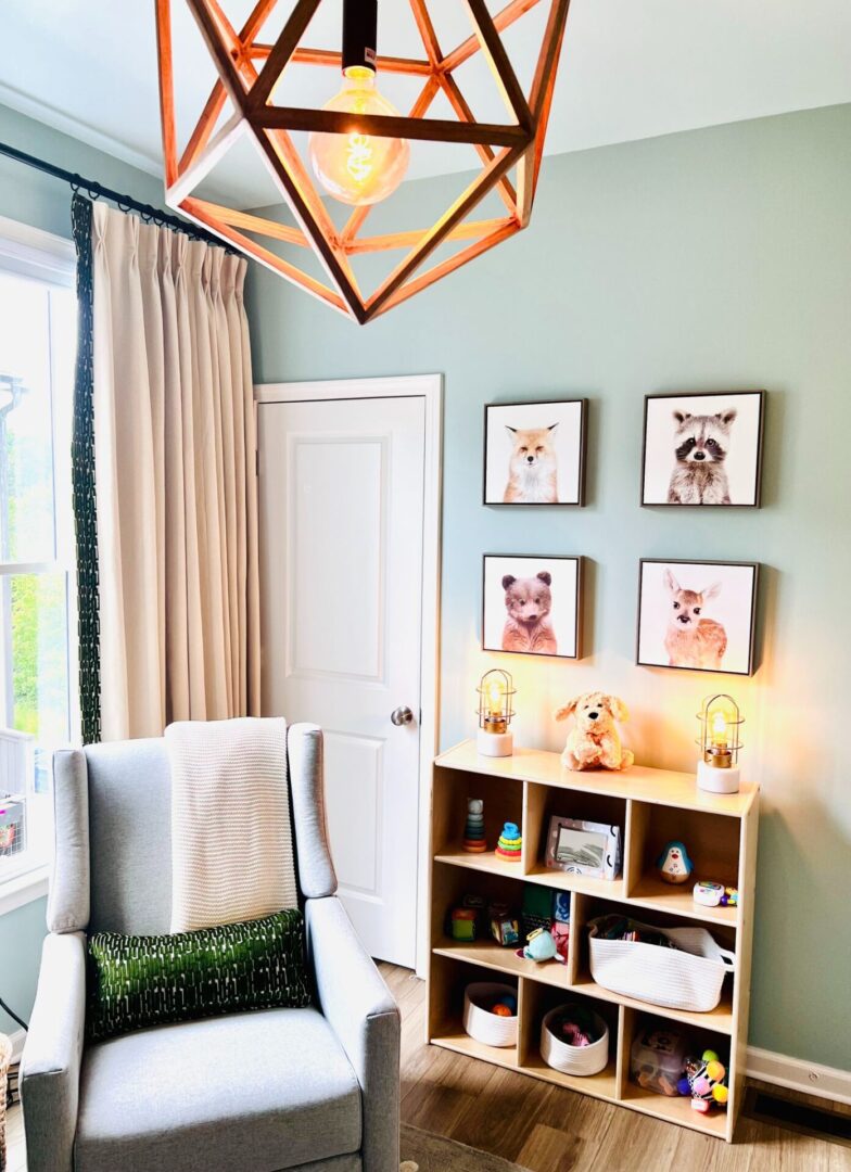 A room with a bookshelf and pictures on the wall