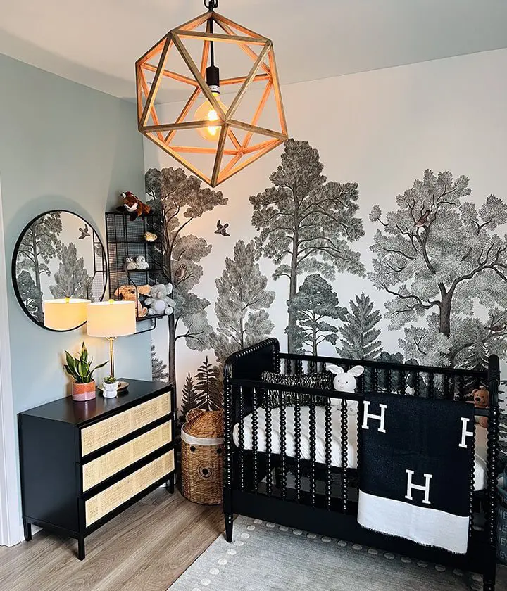 A baby room with a crib and dresser