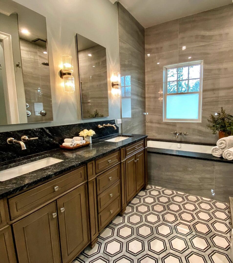 A bathroom with two sinks and a large mirror.